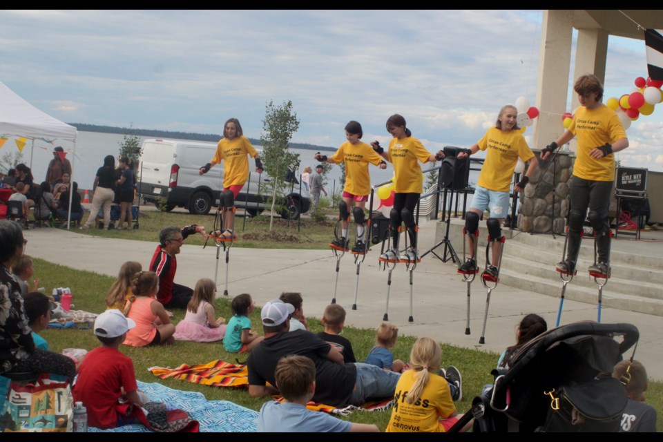 A group of kids who took part in this  year's Flyin' Bob's Circus Camp, which ran from July 29. - Aug. 1, perform a stilt-walking routine during the 2024 Carnival in the Park. Chris McGarry photo. 