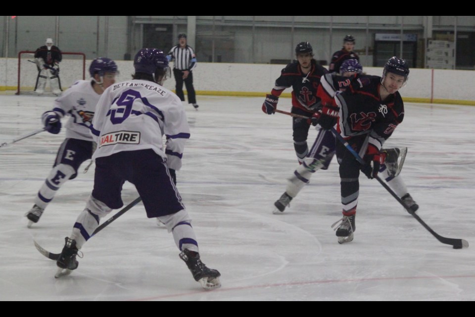 Edson Eagles player Zayne Dettanikkeaze confronts Patrick Bourque as the Lakers forward prepares to shoot during the game between two top teams in the National Junior Hockey League (NJHL) North Division on Feb. 23 at the Bold Centre. Bourque, along with Regan Anderson, scored Lac La Biche’s two goals in the 8-2 game. Chris McGarry photo. 