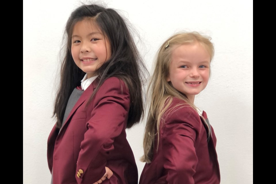 Kylie Patterson (Tolstoy Cast) and Bridget Werner (Slippy Cast) star as Matilda in Royal Theater Academy's production of "Matilda the Musical".