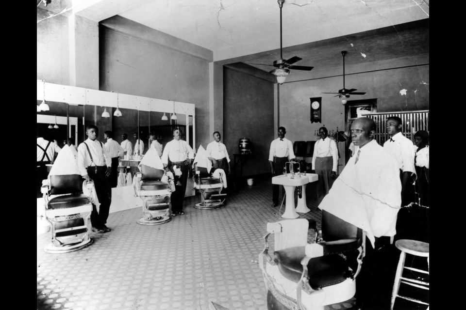 From Central Track, Crossroads of Deep Ellum: A barbershop in the Pythian Temple, ca. 1920s. 