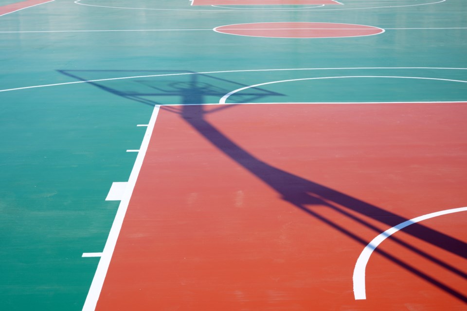 zhengzaishuru_outdoor-basketball-court_shutterstock_2465517021