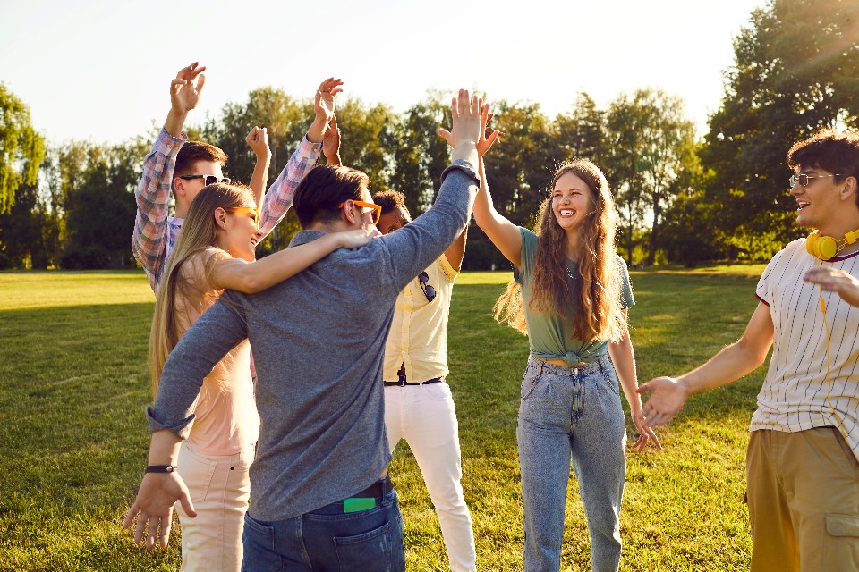 studio-romantic_people-gathered_outside_shutterstock_2166577043
