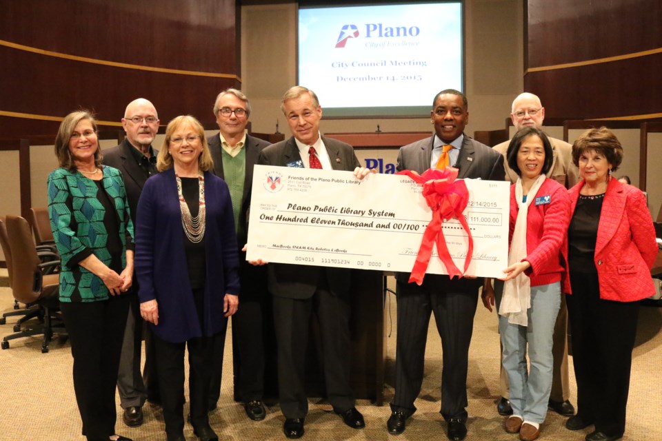 City Council Mayor Plano give Friends check