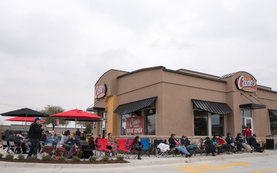 Dreary weather didn't deter any of these people from waiting for their free chicken.