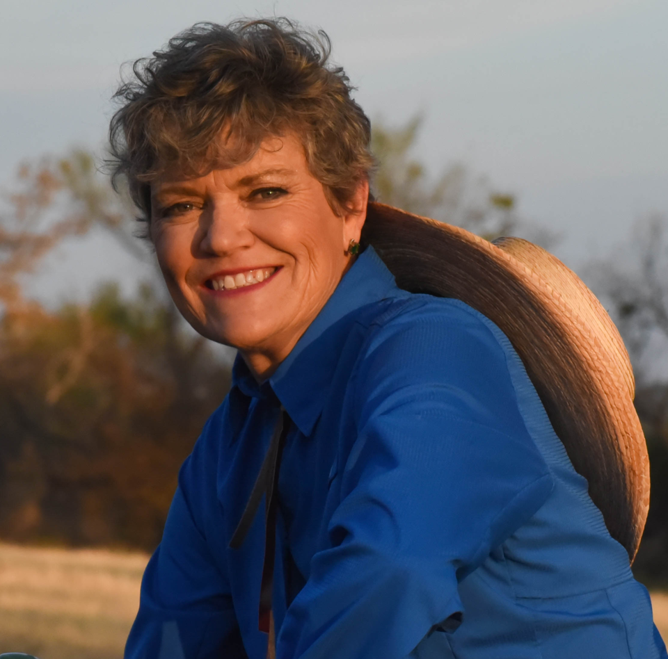 Kim-Olson-headshot-on-tractor-closeup