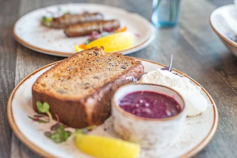 aussie grind breakfast banana bread french toast with sausage on the side