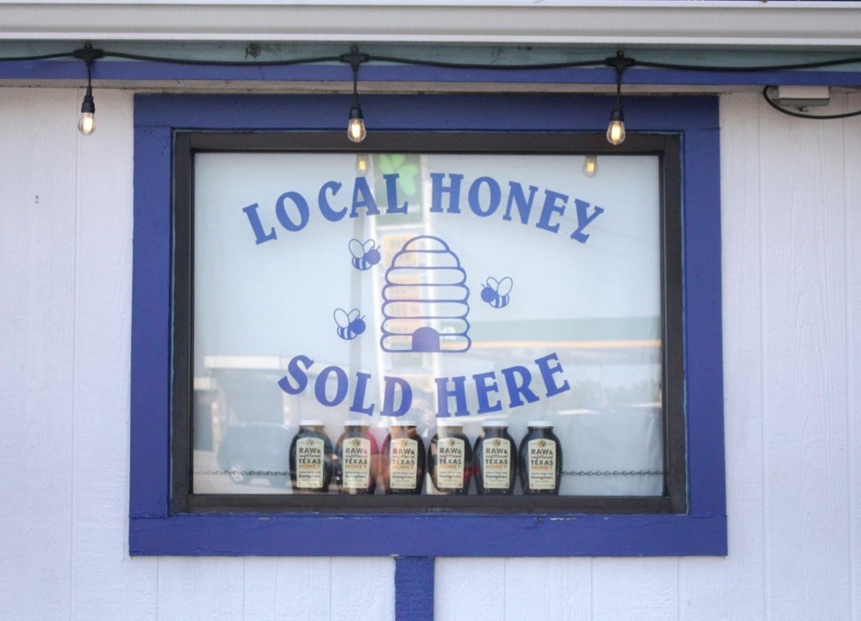 Texas honeybees, local honey sign
