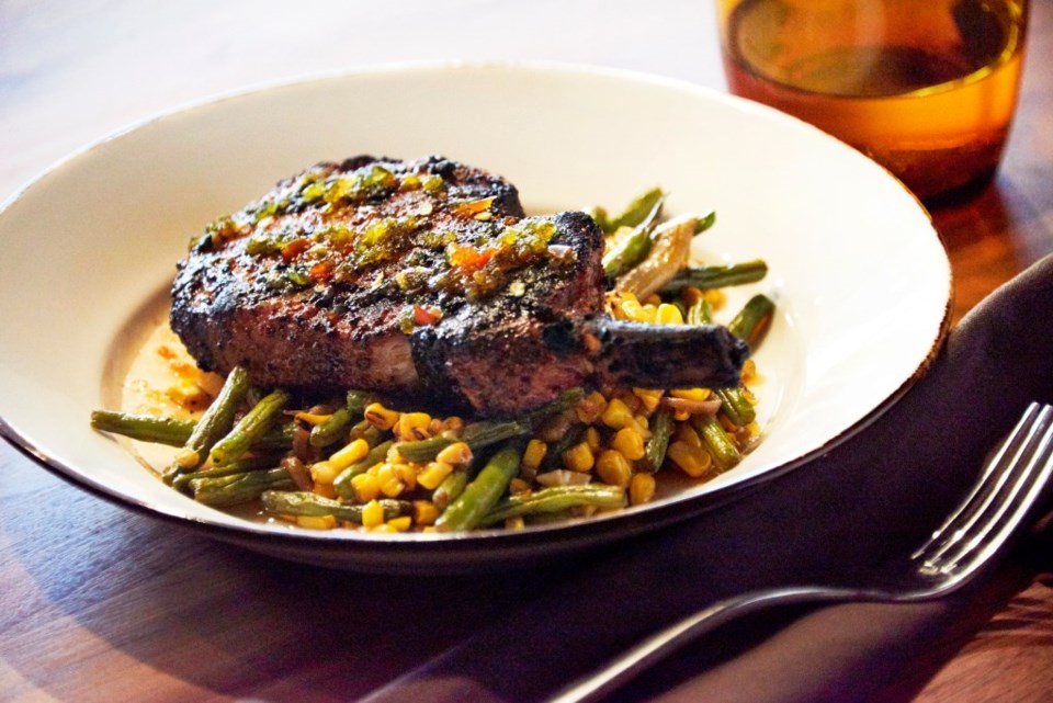 Coriander pork chop on vegetable bed Chef Stephan Pyles Stampede66 Allen