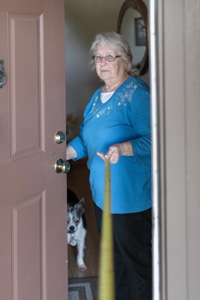 senior woman in her doorway