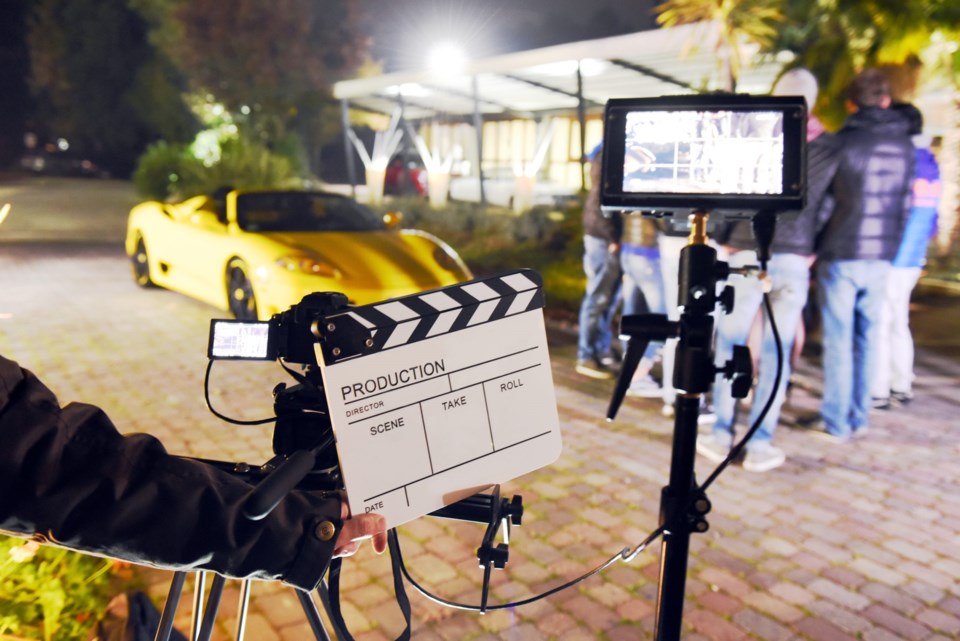 Operator,Holding,Clapperboard,During,The,Production,Of,Short,Film,Outdoor