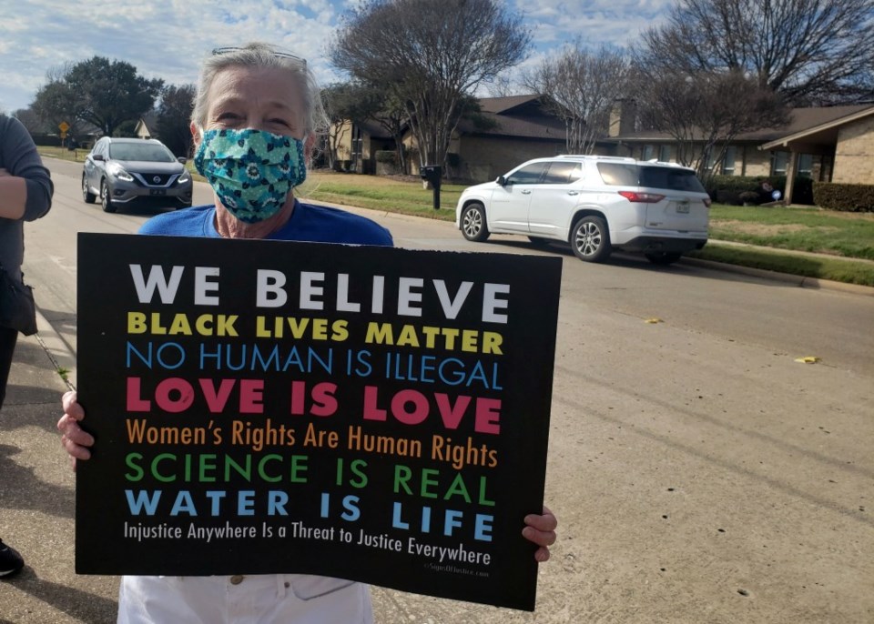 woman protesting in Plano