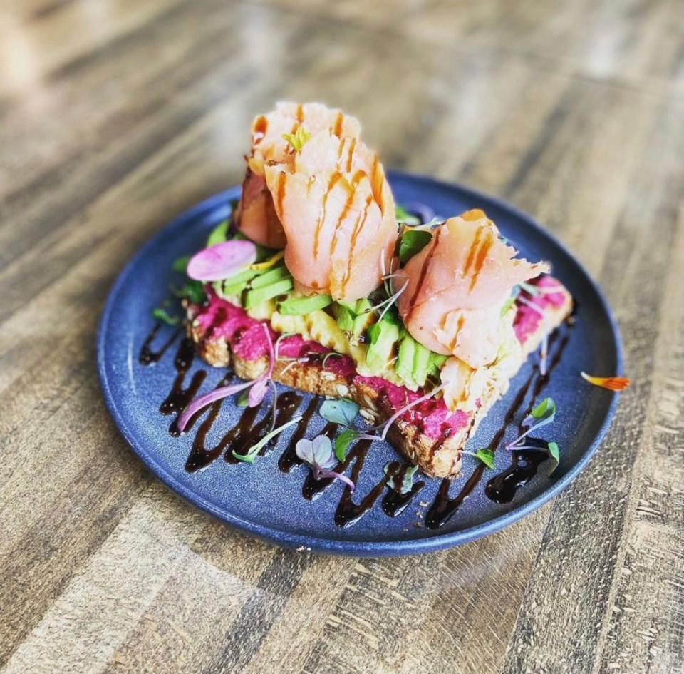 The sunrise toast from The Nest, made with house-made beet hummus, scrambled egg, avocado, smoked salmon and a balsamic glaze. Another favorite among healthy places to eat in Frisco! | Via @thenestcafetx on Instagram
