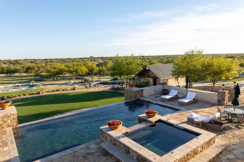 The pool overlooking the green at The JL Bar Ranch, Resort & Spa.