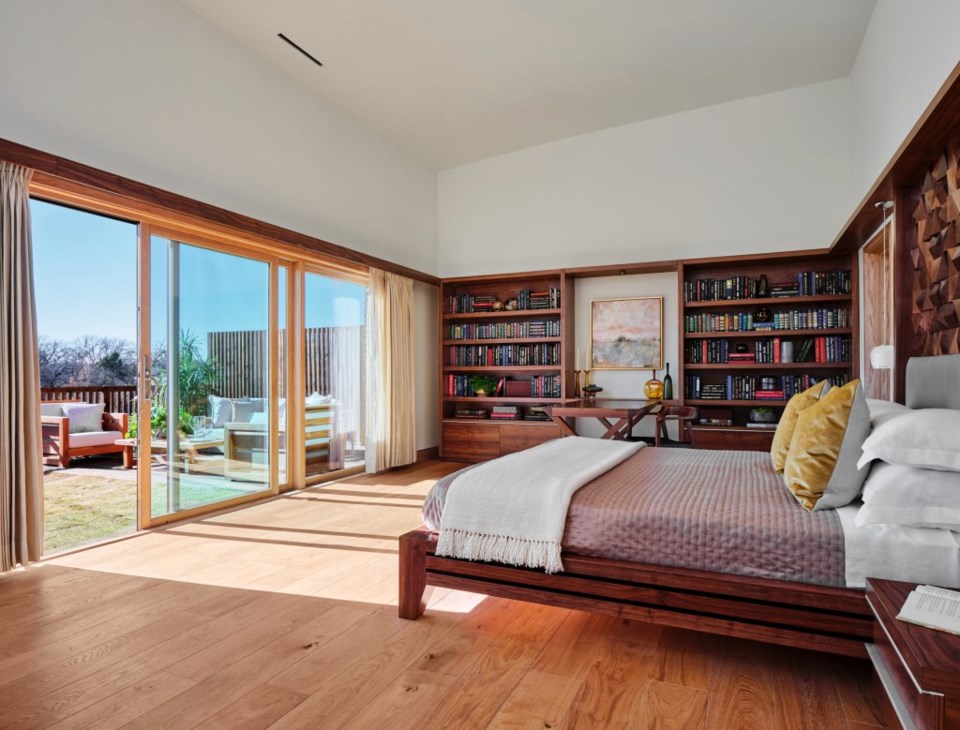 The master bedroom of a Tapestry home, with a garden view.