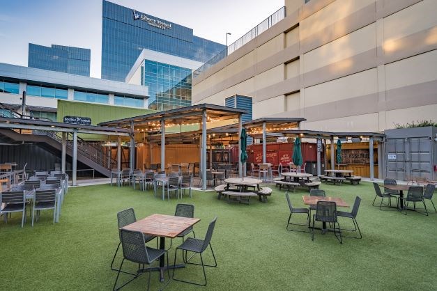 The Box Garden at Legacy Hall is a n amazing spot for great food, live music, and even movie showings! | Courtesy of the Box Garden at Legacy Hall