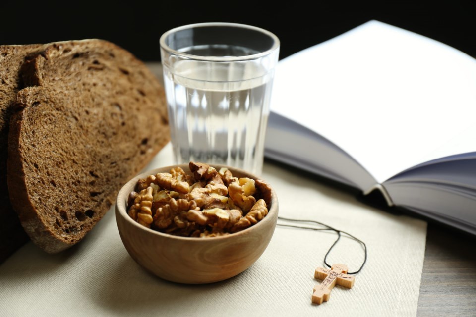 Bread,,Walnuts,,Water,,Bible,And,Crucifix,On,Table.,Great,Lent