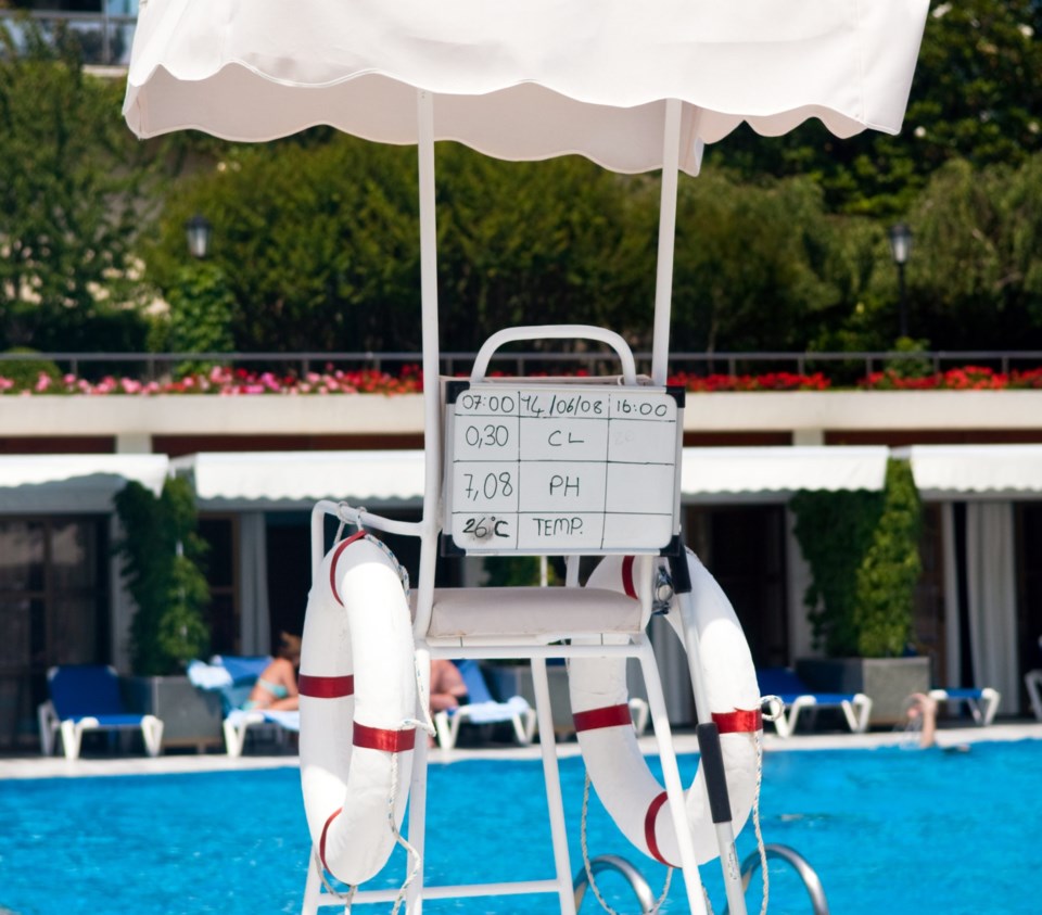A lifeguard seat at a hotel swimming pool.