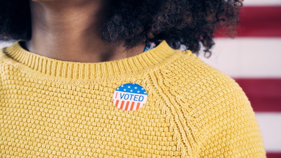 Young,Gen,Z,Voter,Wearing,Sticker,After,Voting,In,Election