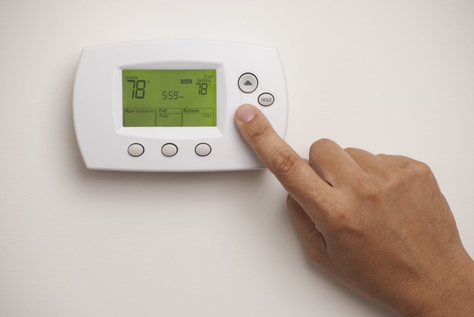 Digital,Thermostat,With,A,Male,Hand,,Set,To,78,Degrees