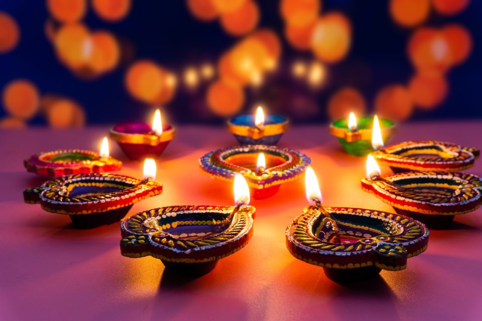 Indian,Festival,Diwali,,Diya,Oil,Lamps,Lit,On,Colorful,Rangoli.