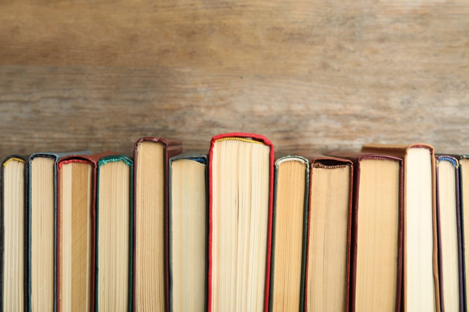 Collection,Of,Old,Books,On,Wooden,Background