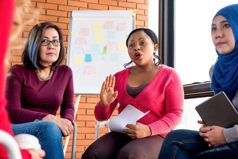 Multiethnic,Women,In,Colorful,Casual,Clothes,Discussing,In,The,Group