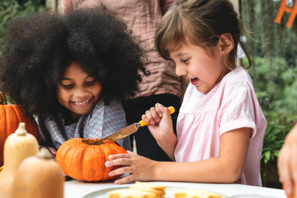 Young,Kids,Carving,Halloween,Jack-o&#8217;-lantern