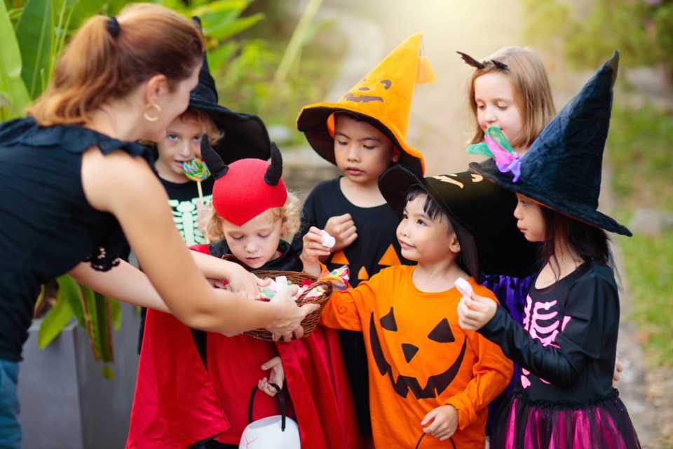 Kids,Trick,Or,Treat,On,Halloween,Night.,Mixed,Race,Asian