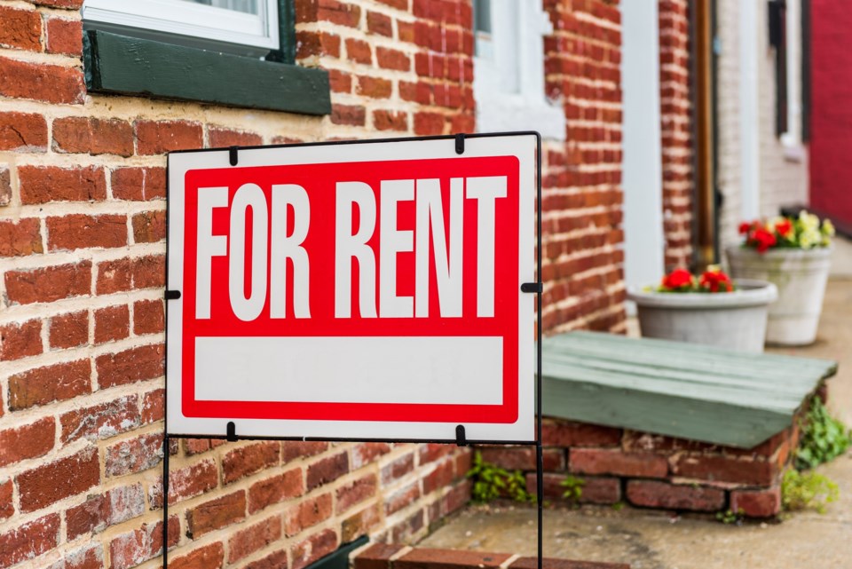 Rent,Sign,Closeup,Against,Brick,Building