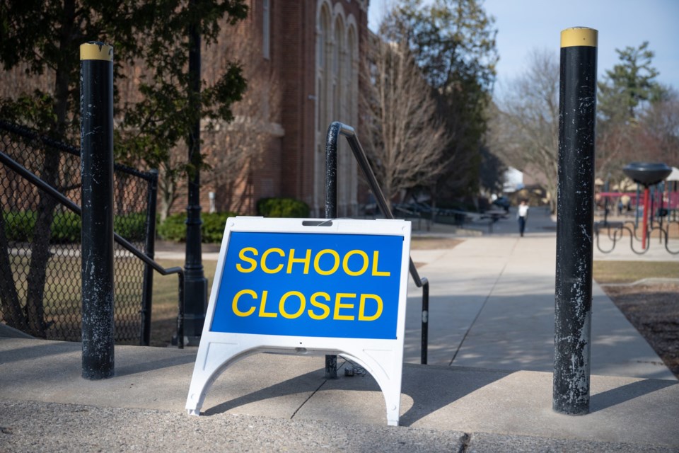 A,&#8221;closed&#8221;,Sign,Outside,Of,A,Public,School,In,Grand