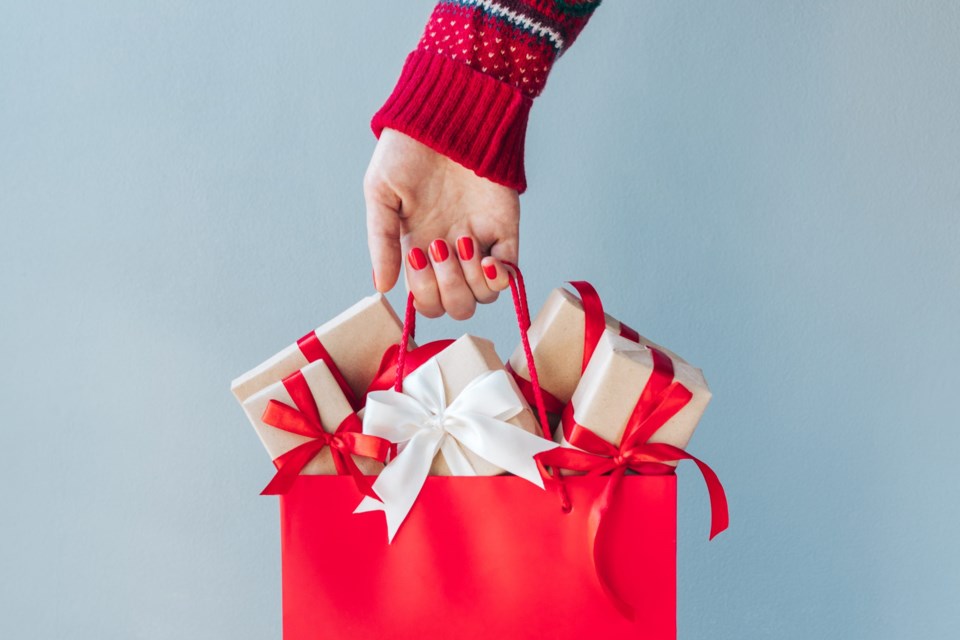 Cropped,Image,Of,Female,Hand,With,Red,Polished,Nails,Holding