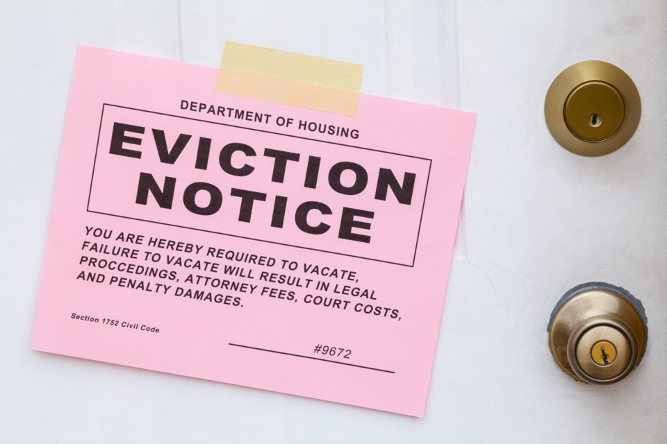 Pink,Eviction,Notice,Taped,On,Front,Door.