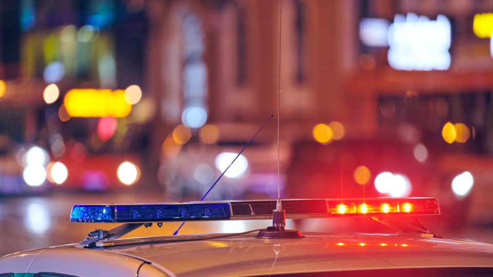 Police,Car,Lights,At,Night,City,Street.,Red,And,Blue