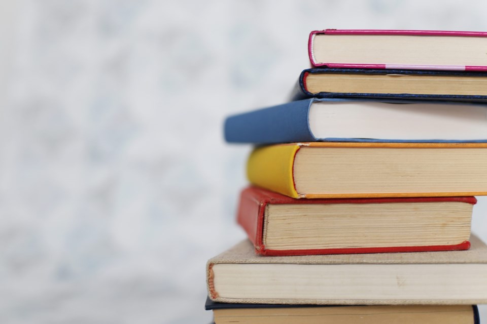 Books,On,A,White,Table,In,A,Bookstore