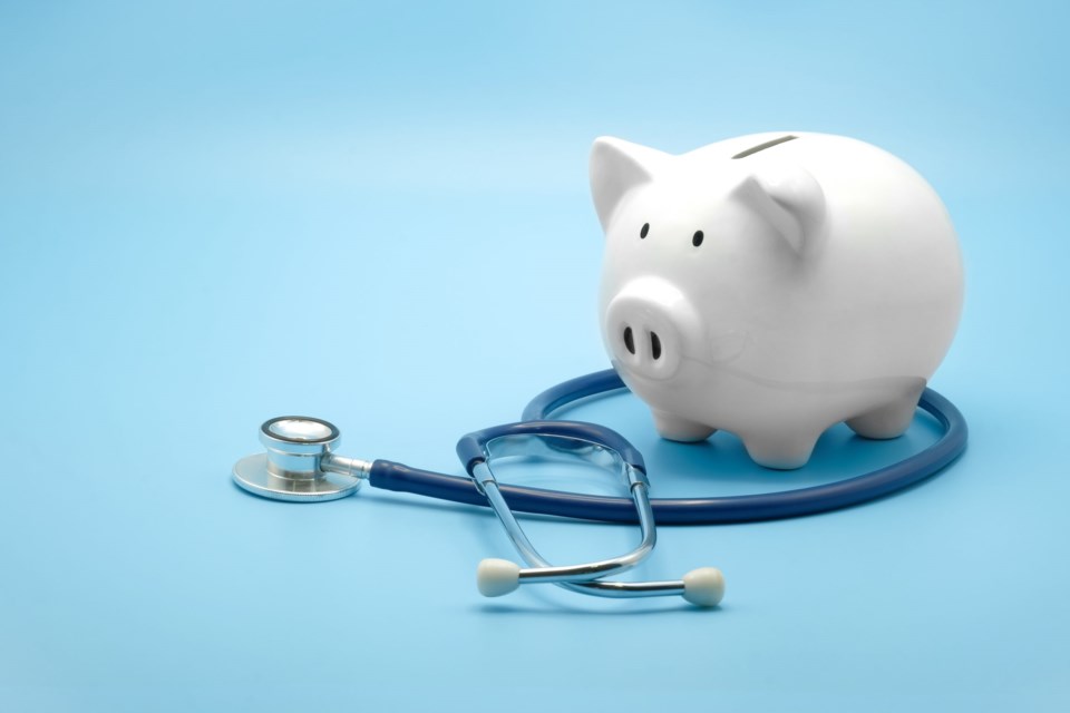 Piggy,Bank,With,Stethoscope,Isolated,On,Light,Blue,Background,With