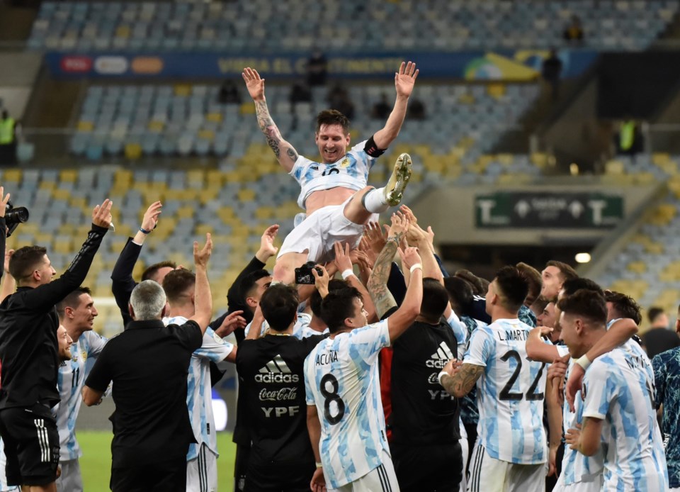 Argentina&#8217;s,Lionel,Messi,Holds,The,Trophy,As,He,Celebrates,With