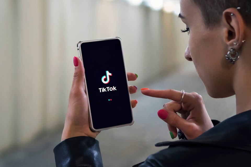 22.07.2018.,Barnaul.,Russia.,Women,Holding,Phone,With,Tiktok,Logo,On