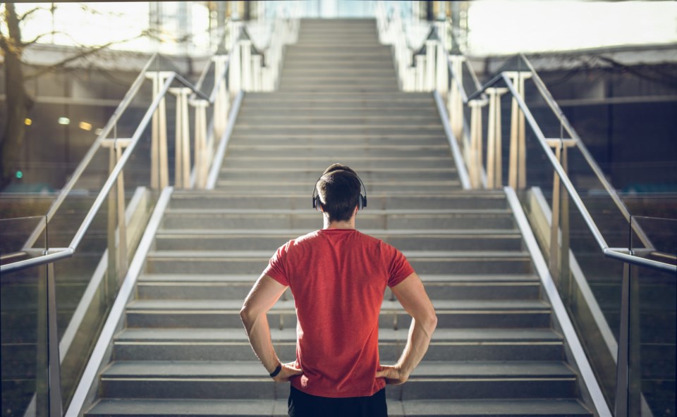 Man,In,Red,Shirt,Preparing,For,Stair,Run.