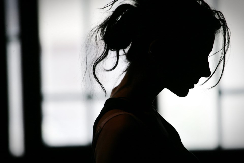 Silhouette,Of,Woman&#8217;s,Head,With,Waving,Hair,,Back,Light.