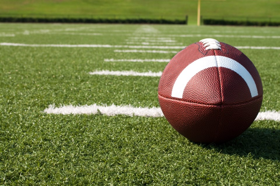Closeup,Of,American,Football,On,Field,With,Yard,Lines.