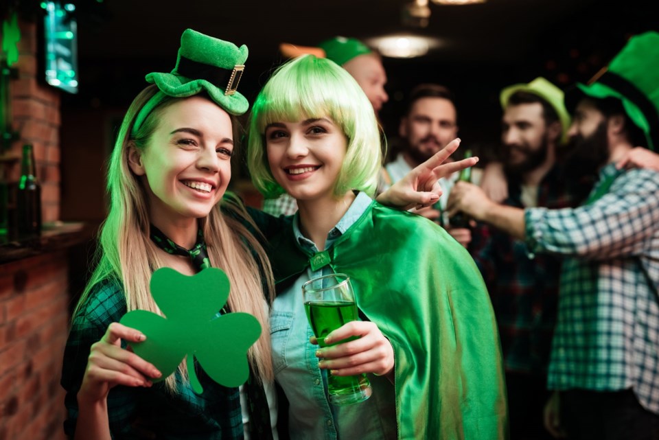 Two,Girls,In,A,Wig,And,A,Cap,Are,Photographed