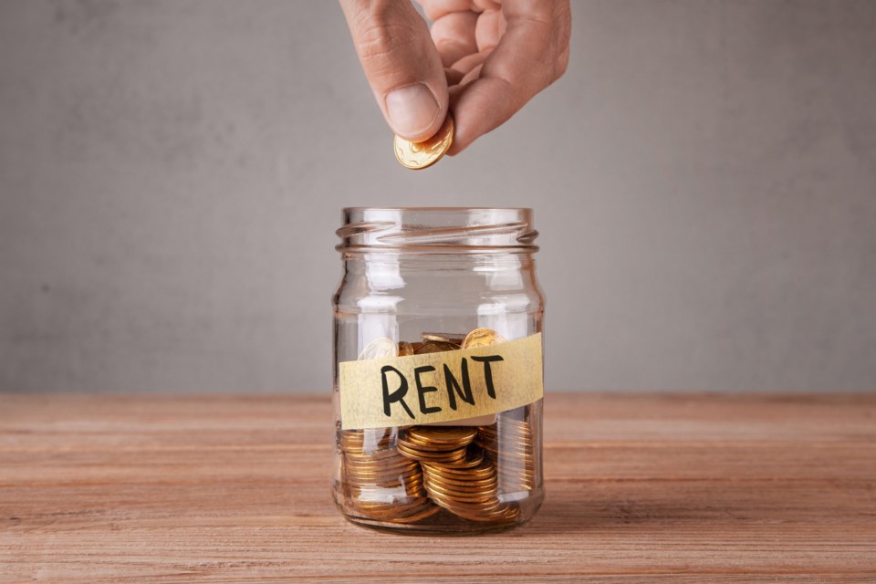 Rent.,Glass,Jar,With,Coins,And,An,Inscription,Rent.,Man