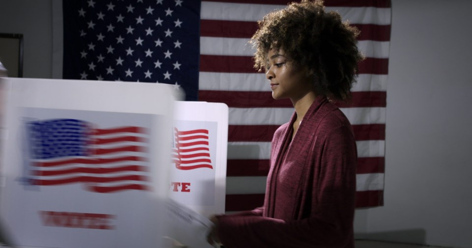 Ms,Young,Woman,Ready,To,Vote,With,Blurred,Voting