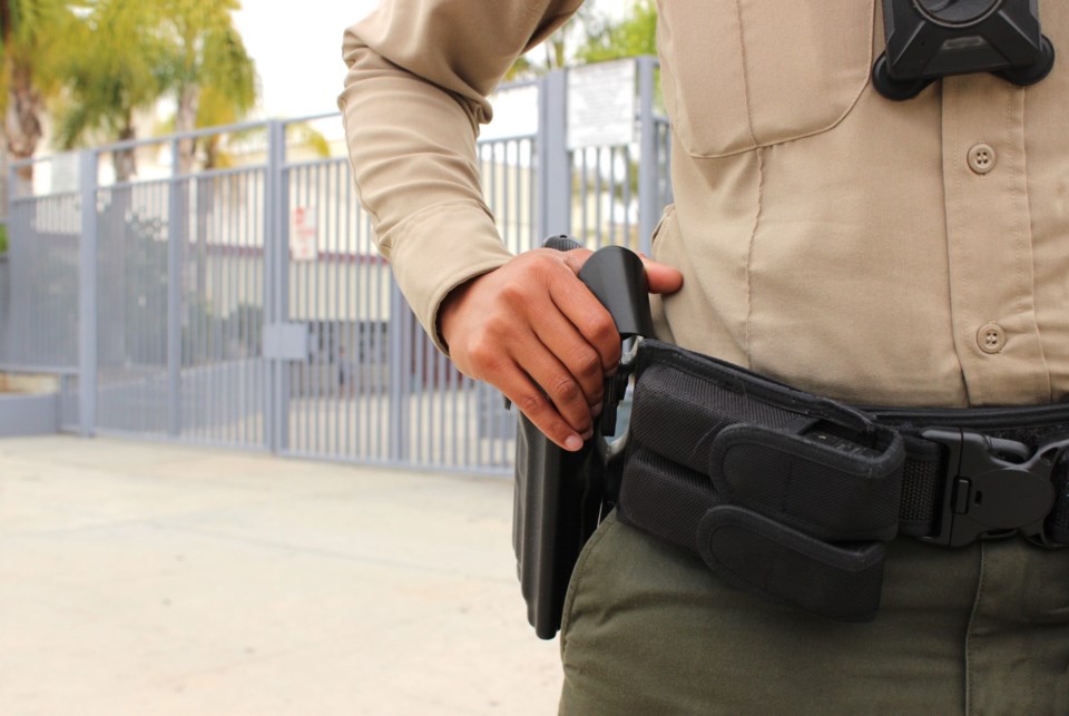 School,Safety,Concept,-,Armed,Police,Officer,On,Duty,Protecting