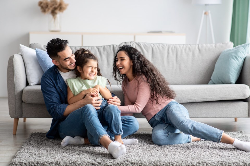 Parents,Having,Fun,With,Their,Little,Daughter,At