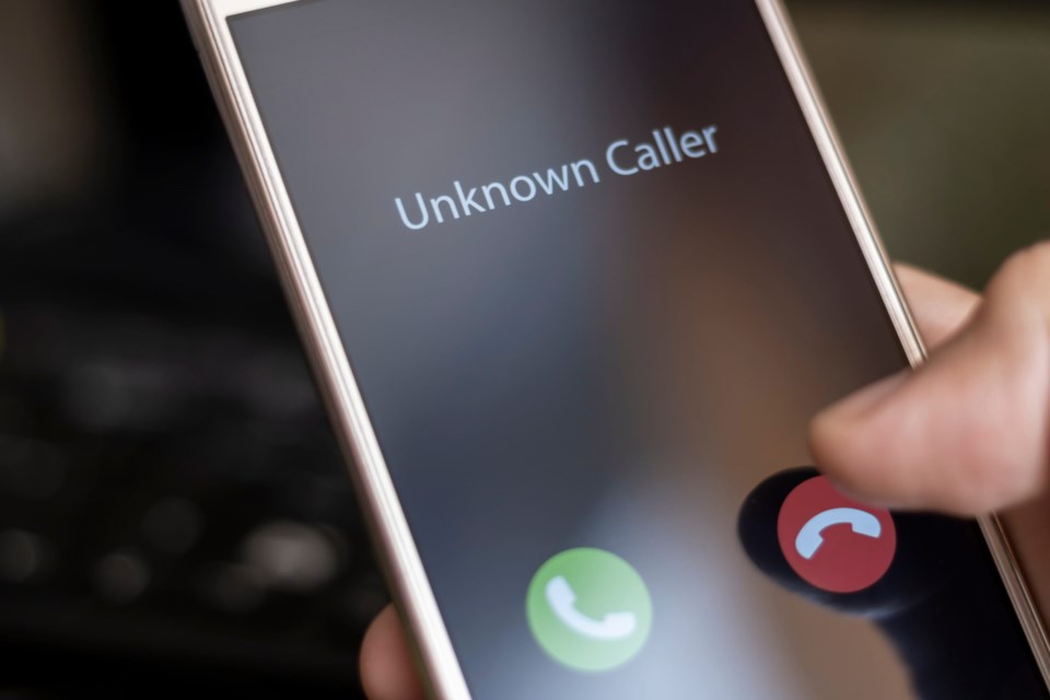 Unknown,Caller.,A,Man,Holds,A,Phone,In,His,Hand