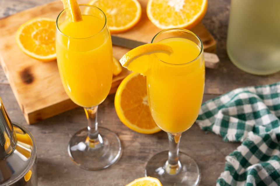 Orange,Mimosa,Cocktail,On,Wooden,Table