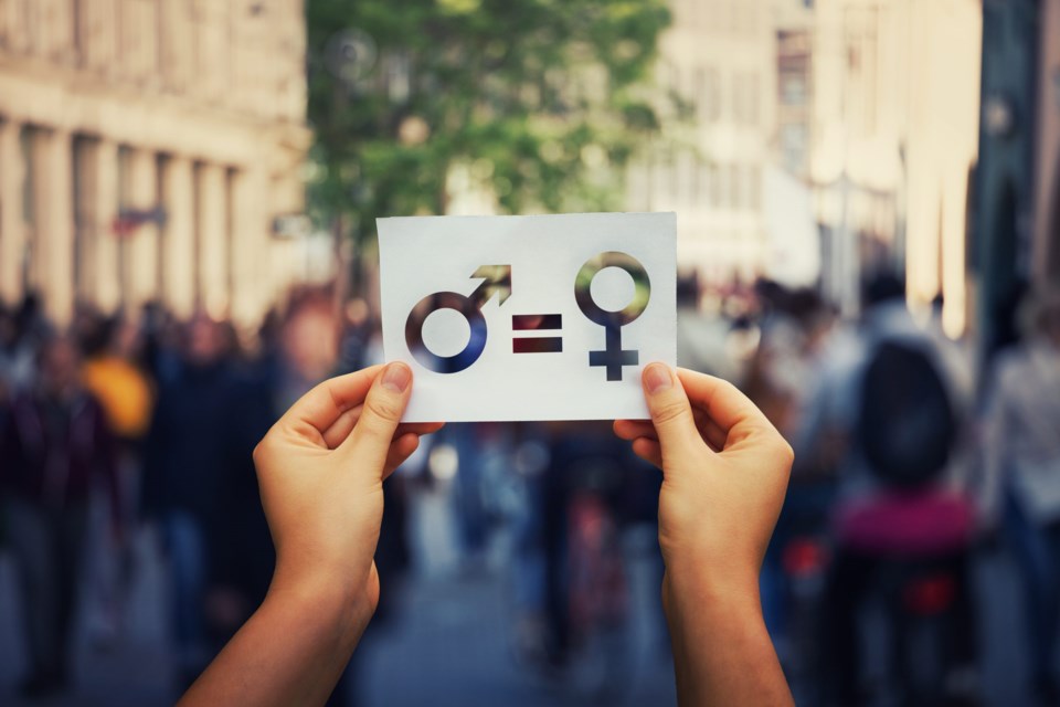 Gender,Equality,Concept,As,Woman,Hands,Holding,A,White,Paper