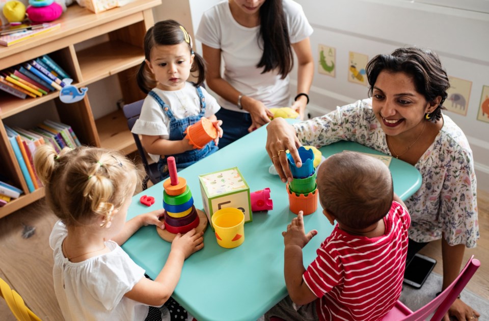 Nursery,Children,Playing,With,Teacher,In,The,Classroom
