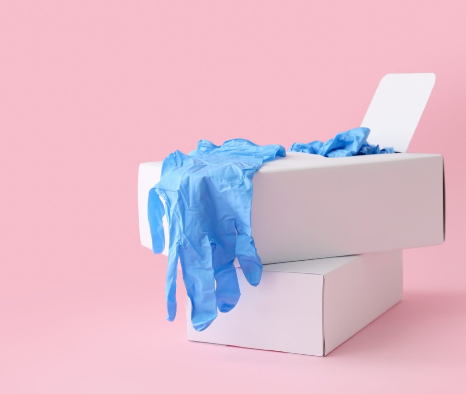 Paper,Boxes,With,Medical,Gloves,On,Pink,Background